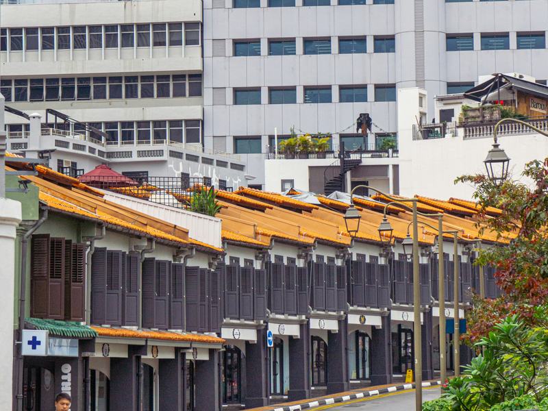 Heritage shophouses beside modern offices